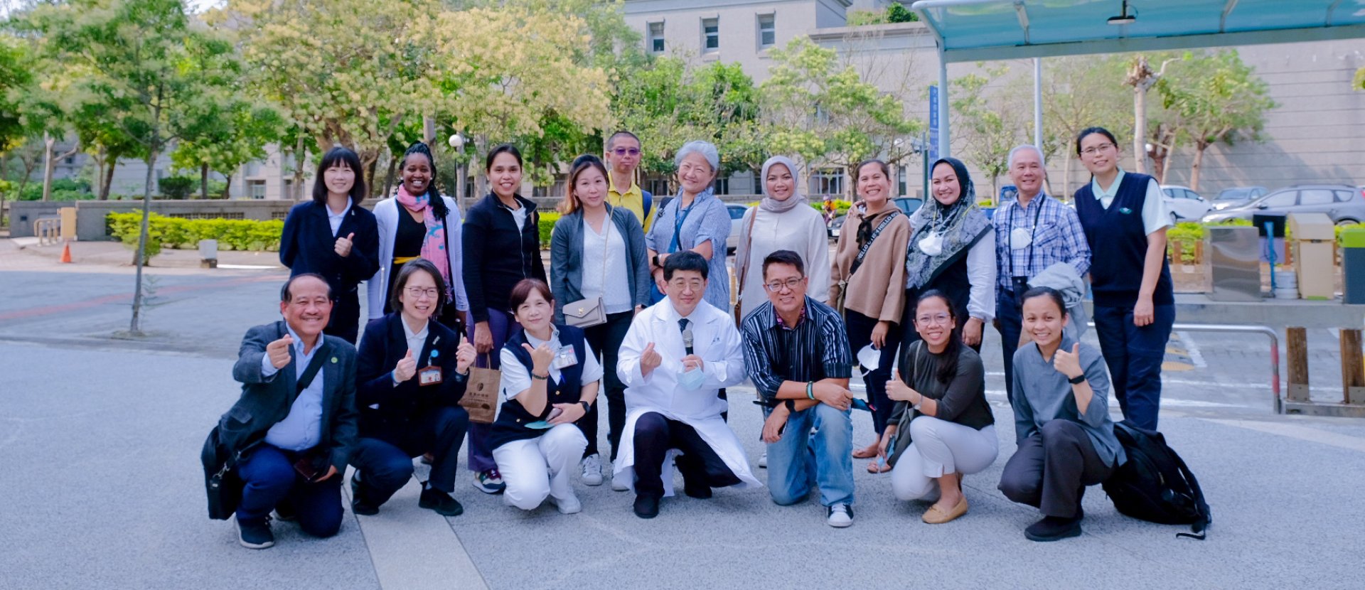 Members of GGHH together in front of a building